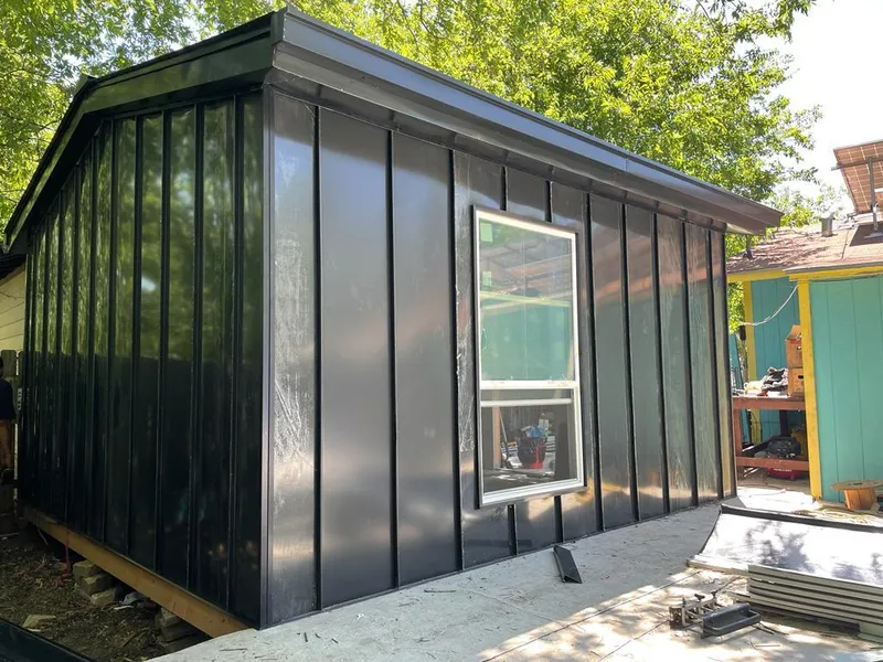 Black standing seam metal wall panels for Metal Roof Installation in Reynolds